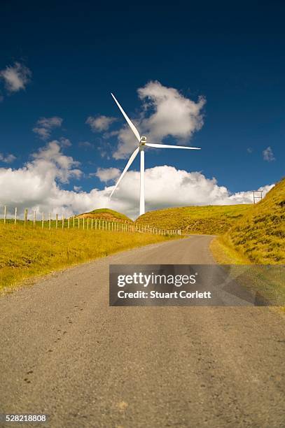 a wind turbine along the side of the road - palmerston stock pictures, royalty-free photos & images