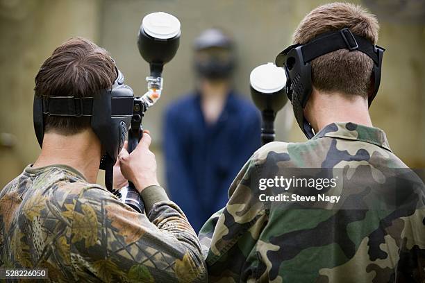 paintball firing squad - firing squad stock-fotos und bilder