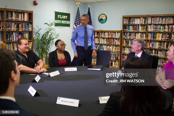 President Barack Obama participates in a neighborhood listening roundtable at Flint Northwestern High School in Flint, Michigan, May 4, 2016.