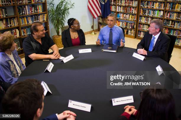 President Barack Obama participates in a neighborhood listening roundtable at Flint Northwestern High School in Flint, Michigan, May 4, 2016.