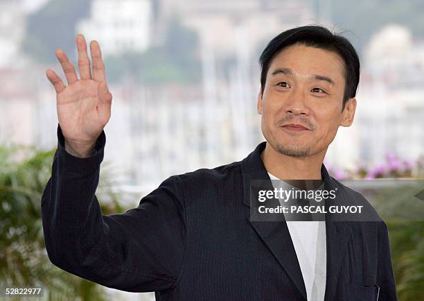 Chinese actor Tony Leung Ka-fai Ka Fai waves at photographers during a photo call for Chinese director Johnnie To's film "Election", 14 May 2005 at...