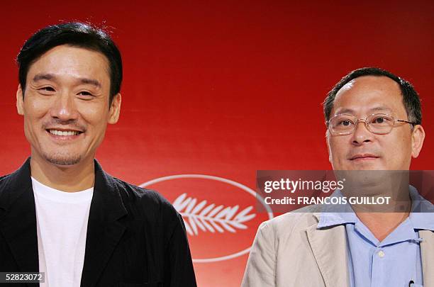 Chinese actor Tony Leung Ka-fai Ka Fai smiles next to Chinese director Johnnie To during a press conference for Chinese director Johnnie To's film...