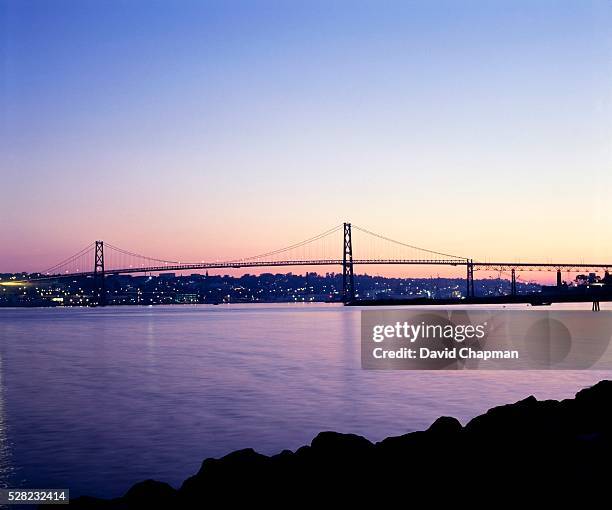 angus l. macdonald bridge above halifax harbor - halifax bridge stock pictures, royalty-free photos & images