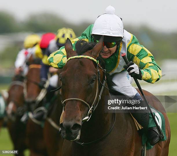 Philip Robinson and Rakti lead the field home to land The Juddmonte Lockinge Stakes Race run at Newbury Racecourse on May 14, 2005 in Newbury,...