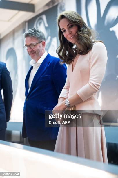 Britain's Catherine, Duchess of Cambridge , visits the "Vogue 100: A Century of Style" exhibition at the National Portrait Gallery in central London...