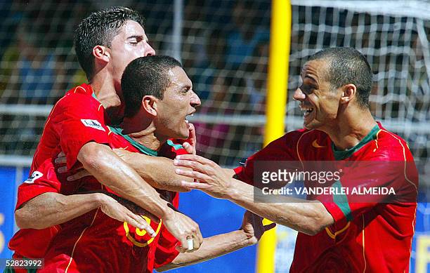 Portugal's Alan Cavalcanti , Tiago Jonas and Joao Victor Madjer, celebrate their victory over Brazil in a Fifa Beach-Soccer World Cup semifinal match...