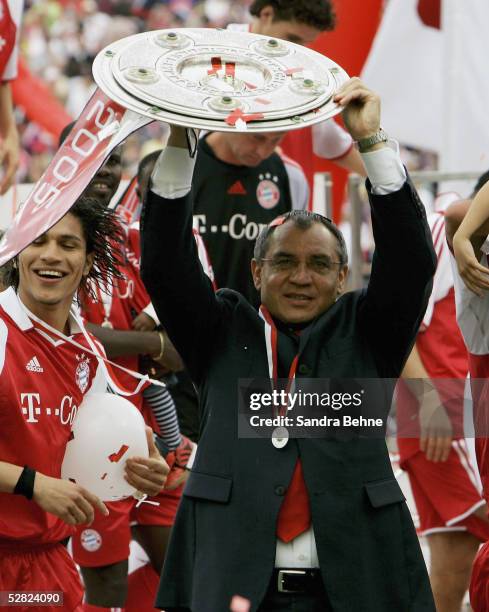 Coach Felix Magath of Munich celebrates with the trophy after the 1. Bundesliga match between FC Bayern Munich and 1.FC Nuremberg at the Olympic...