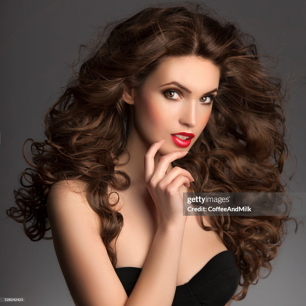 Expressive studio shot of young beautiful woman