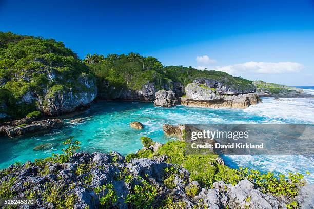a popular swimming spot on niue island; niue - climate of niue stock pictures, royalty-free photos & images