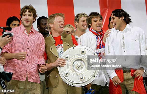 Torsten Frings, Oliver Kahn, Sebastian Deisler and Claudio Pizarro of Munich celebrate with the trophy during the Bayern Munich Champions Party at...