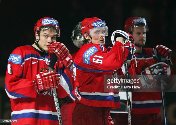Denis Denisov and Maxim Afinogenov of Russia react after losing to Canada in the IIHF World Men's Championships semi-final game at Wiener Stadthalle...
