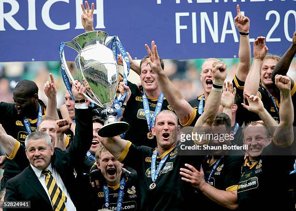 Head coach, Warren Gatland and captain, Lawrence Dallaglio hold up the trophy after winning the Zurich Premiership Final match between Leicester...