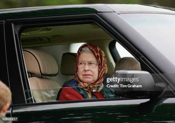 Her Majesty Queen Elizabeth II drives her Range Rover at the Royal Windsor Horse Show in the grounds of Windsor Castle on May 14, 2005 in Windsor,...