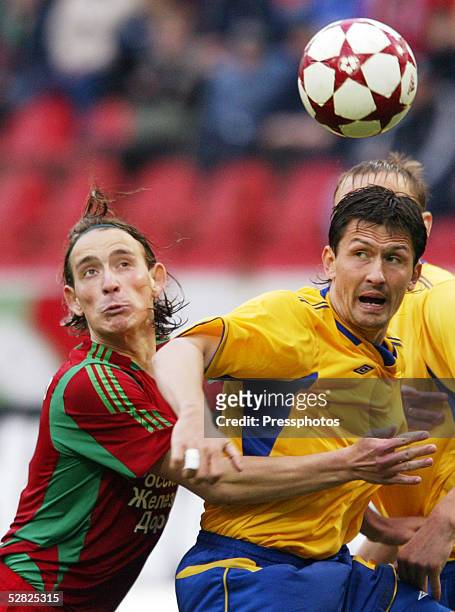 Igor Lebedenko of Lokomotiv challenges Nikolai Shirshov of Rostov for the ball during the Russian Premier League match between Lokomotiv Moscow and...