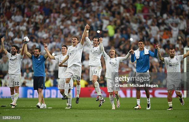 Real Madrid players celebrate following their team's 1-0 victory during the UEFA Champions League semi final, second leg match between Real Madrid...