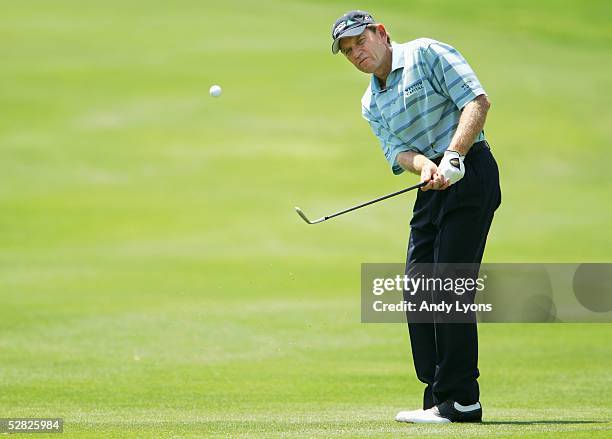 Nick Price of Zimbabwe hits his third shot on the par 4 3rd hole during the third round of the EDS Byron Nelson Championship on May 14, 2005 at the...