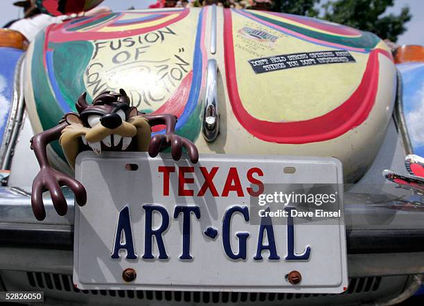 The license plate says it all on "Fusion of Contradiction" during the Everyone's Art Car Parade May 14, 2005 in Houston, Texas. The parade includes...