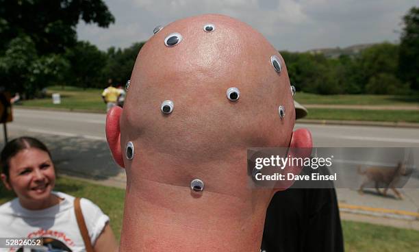 Kevin Bryant appears to see in all directions as he talks with spectators during the Everyone's Art Car Parade May 14, 2005 in Houston, Texas. The...