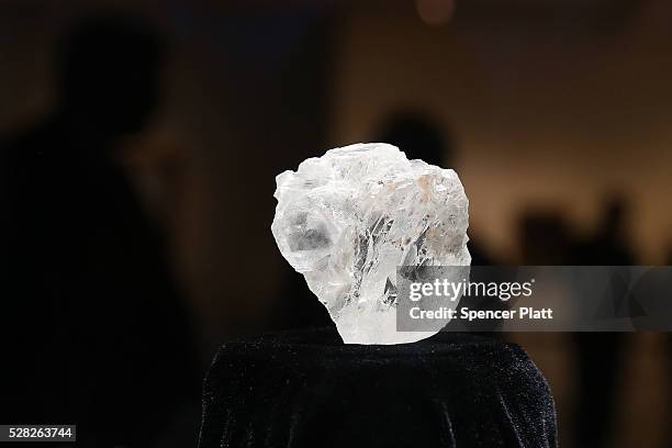 The 1109-carat rough Lesedi La Rona diamond, the biggest rough diamond discovered in more than a century, sits in a display case at Sotheby's on May...