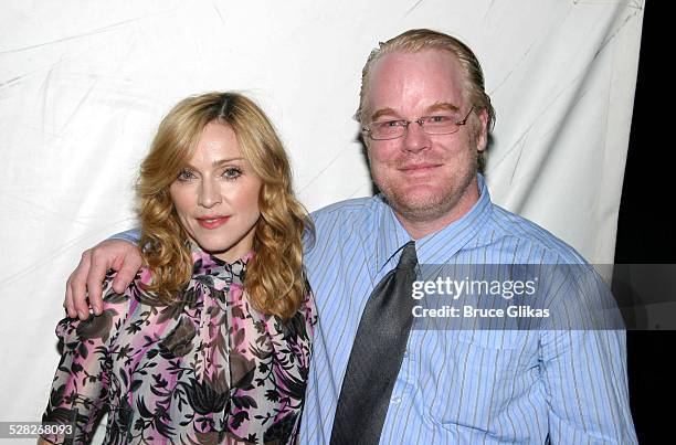 Madonna and Philip Seymour Hoffman during LAByrinth Theater Company Celebrity Charades Benefit at The Daryl Roth Theater in New York City, New York,...