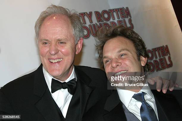 John Lithgow and Norbert Leo Butz during Opening Night Curtain Call and Party for Dirty Rotten Scoundrels on Broadway at Imperial Theater thenThe...