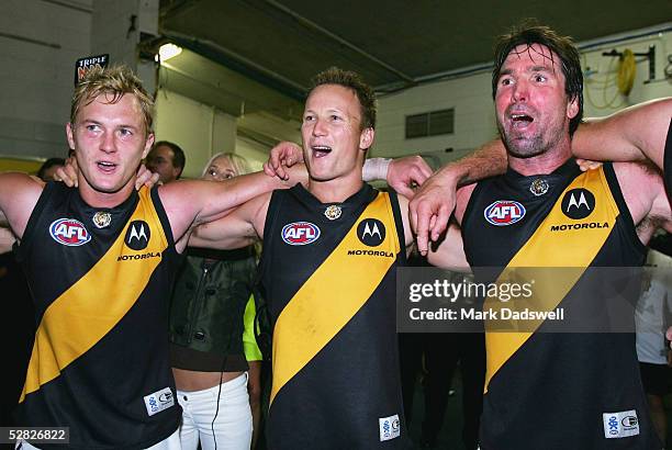 Kayne Pettifer, Nathan Brown and Wayne Campbell for the Tigers celebrate during the AFL Round 8 match between the Collingwood Magpies and the...