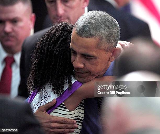 President Barack Obama hugs Maryanna Copeny of Flint, Michigan, age 8, after speaking at Northwest High School about the Flint water contamination...