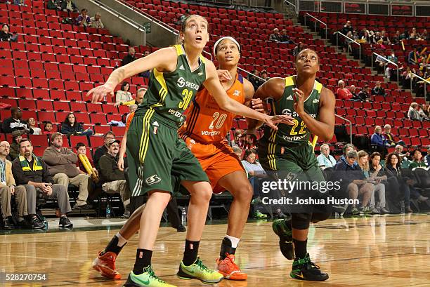 Breanna Stewart and Monica Wright of Seattle Storm boxes out against Isabelle Harrison of the Phoenix Mercury on May 4, 2016 at Key Arena in Seattle,...