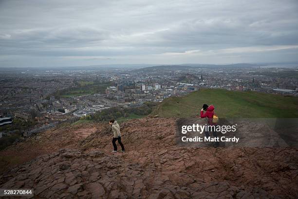 Walkers brave the winds at Arthur's Seat in Holyrood Park on May 4, 2016 in Edinburgh, Scotland. As campaigning for the Holyrood election enters its...