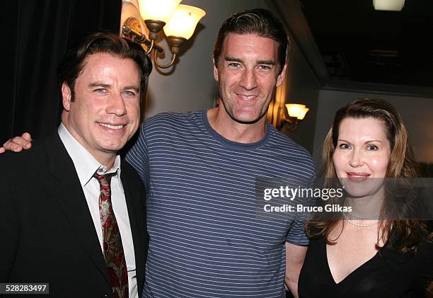 Actor John Travolta poses with actor Patrick Boll, and playwright Myra Bairstow when he visits The Rise of Dorothy Hale Off-Broadway at St. Lukes...