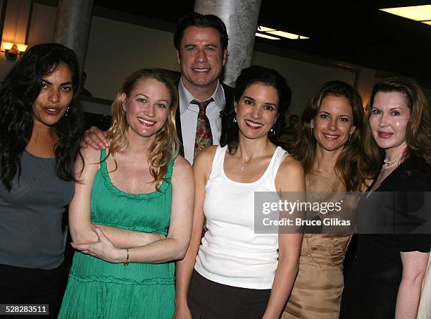 Actor John Travolta poses with Sarita Choudhury, Sarah Wynter, Laura Koffman, Kelly Preston and playwright Myra Bairstow when he visits The Rise of...