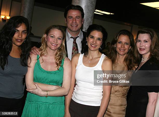 Actor John Travolta poses with Sarita Choudhury, Sarah Wynter, Laura Koffman, Kelly Preston and playwright Myra Bairstow when he visits The Rise of...