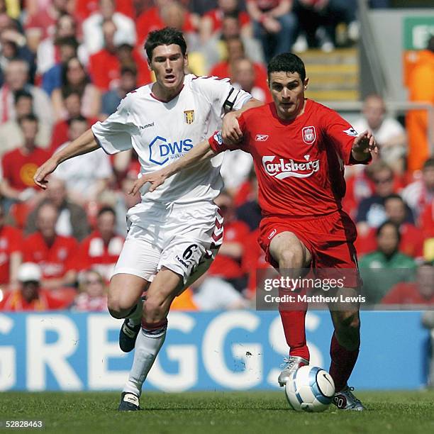 Gareth Barry of Aston Villa and Antonio Nunez of Liverpool challenge for the ball during the Barclays Premiership match between Liverpool and Aston...