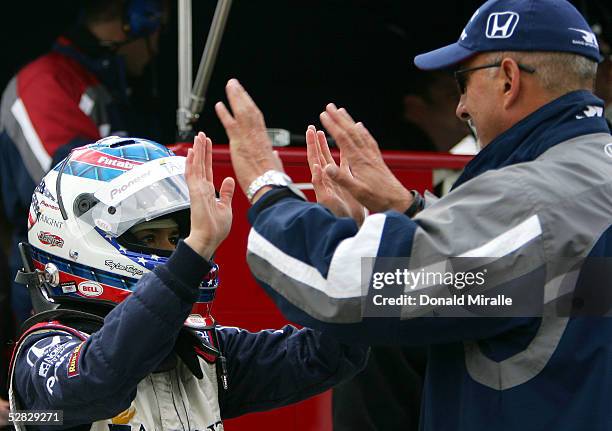 Danica Patrick, driver of the Rahal Letterman Racing Argent Pioneer Panoz Honda, talks to team owner Bobby Rahal in the pits during Pole Day...