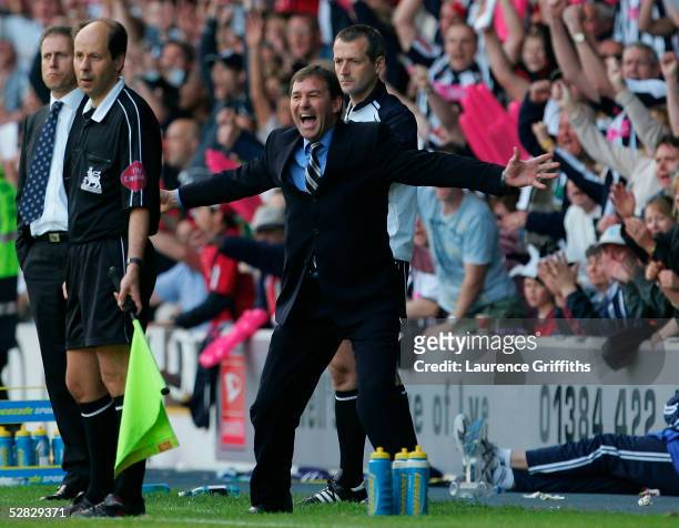 Bryan Robson, the WBA manager celebrates his team scoring a second goal during the Barclays Premiership match between West Bromwich Albion and...
