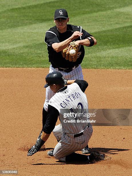 Shortstop Clint Barmes of the Colorado Rockies completes a double play against Alex Cintron of the Arizona Diamondbacks in the second inning on May...