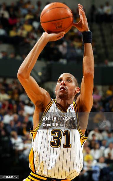 Reggie Miller of the Indiana Pacers takes a free throw shot in the second half against the Detroit Pistons in Game four of the Eastern Conference...