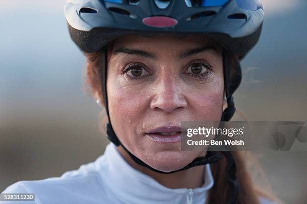 a woman in a bicycle helmet dripping with sweat; tarifa cadiz andalusia spain - effort face stock pictures, royalty-free photos & images