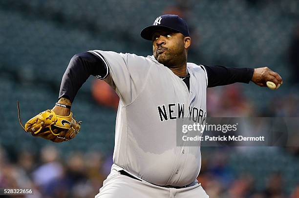 Starting pitcher CC Sabathia of the New York Yankees throws a pitch to a Baltimore Orioles batter in the first inning during a baseball game at...