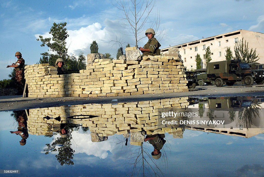 Uzbek soldiers guard a street of Andijan