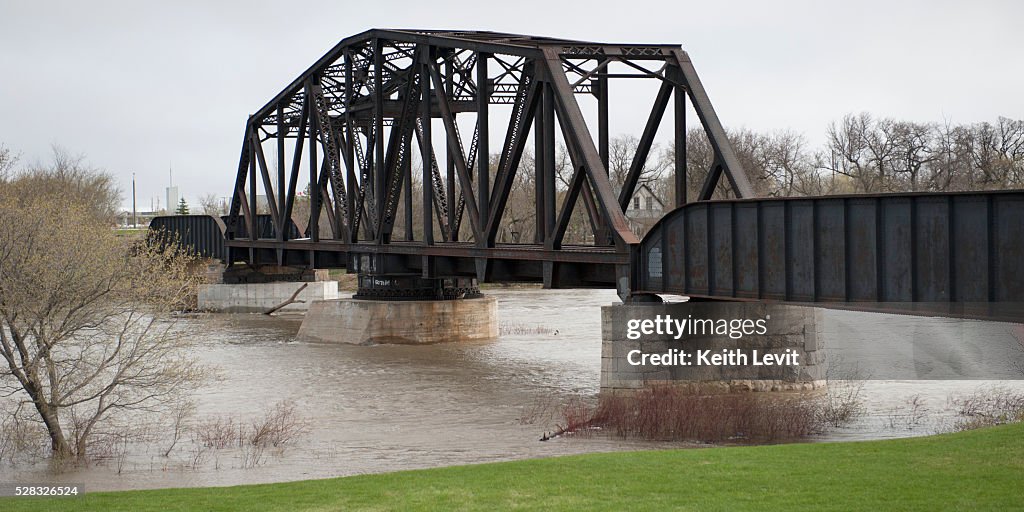 A Bridge Crossing Assiniboine River With High Waters After A Flood; Headingley, Manitoba, Canada