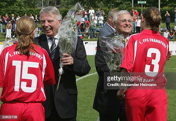 The president of the German Football Leaque, Theo Zwanziger , and vice president Engelbbert Nelle congatulate the players after the German Womens...