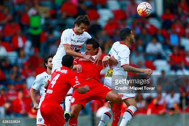 Aaron Galindo of Toluca fights for the ball with Hudson of Sao Paulo during the match between Toluca and Sao Paulo as part of the Copa Bridgestone...