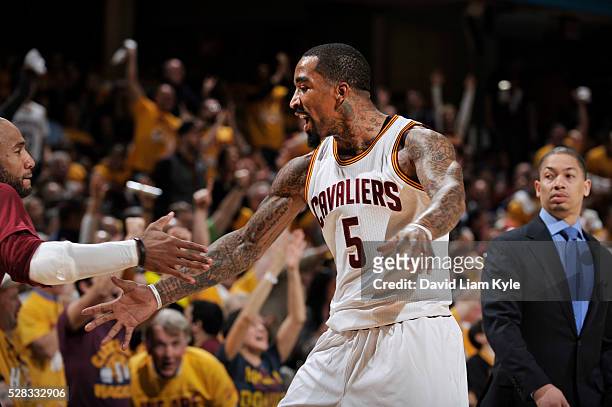 Smith of the Cleveland Cavaliers high fives teamamtes during Game Two of the Eastern Conference Semifinals during the 2016 NBA Playoffs against the...