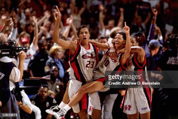 The Houston Comets celebrate at center court after winning the 1997 WNBA Finals at the Compaq Center circa 1997 in Houston, Texas. NOTE TO USER: User...