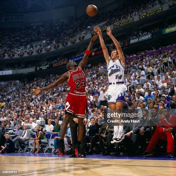 Jeff Hornacek of the Utah Jazz takes a jumper over Michael Jordan of the Chicago Bulls during game five of the 1997 NBA Finals at the Delta Center on...