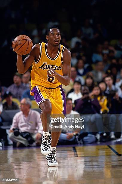 Kobe Bryant of the Los Angeles Lakers advances the ball on the dribble against the Washington Bullets during the NBA game on February 2, 1997 in Los...