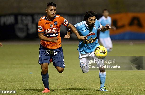 Jorge Cazulo of Sporting Cristal struggles for the ball with Daniel Chavez of Cesar Vallejo during a match between Cesar Vallejo and Sporting Cristal...