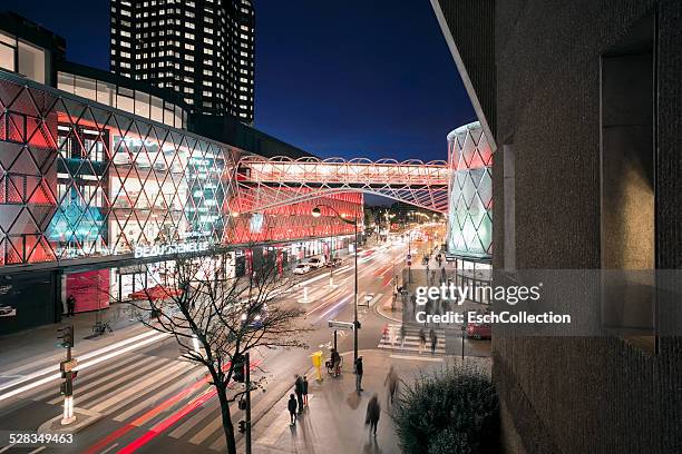 busy street with led illuminated shopping mall - shopping center outside stock pictures, royalty-free photos & images