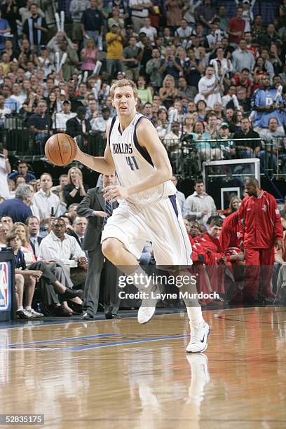 Dirk Nowitzki of the Dallas Mavericks dribbles the ball upcourt against the Houston Rockets in Game seven of the Western Conference Quarterfinals...